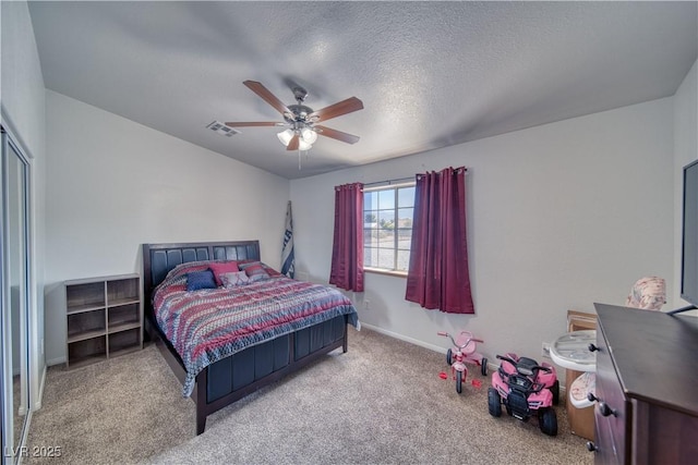 3581 Margarita Ave, Pahrump, NV 89048 - carpeted bedroom with baseboards, a ceiling fan, and a textured ceiling