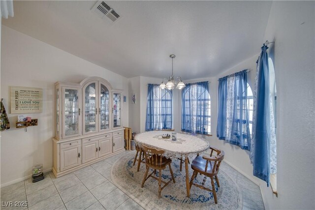 3581 Margarita Ave, Pahrump, NV 89048 - dining room featuring a chandelier, light tile patterned floors, and baseboards