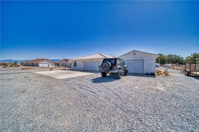 3581 Margarita Ave, Pahrump, NV 89048 - ranch-style home with an attached garage and driveway