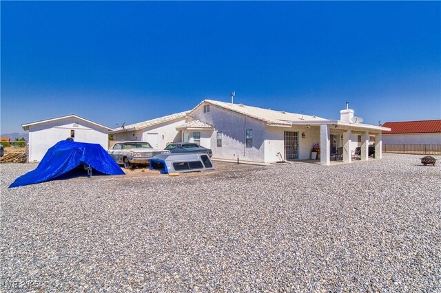 3581 Margarita Ave, Pahrump, NV 89048 - rear view of property with a chimney
