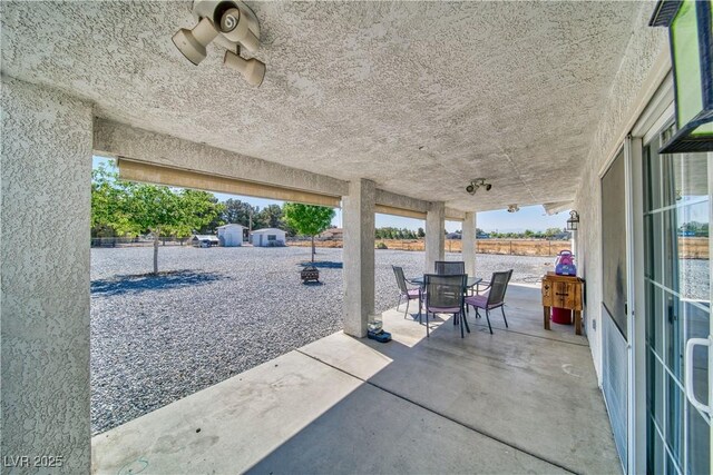 3581 Margarita Ave, Pahrump, NV 89048 - view of patio / terrace featuring a water view and outdoor dining area