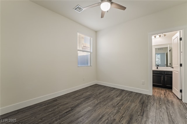 133 Clouded Ave, Henderson, NV 89002 - unfurnished bedroom with dark wood-style flooring, baseboards, and a ceiling fan