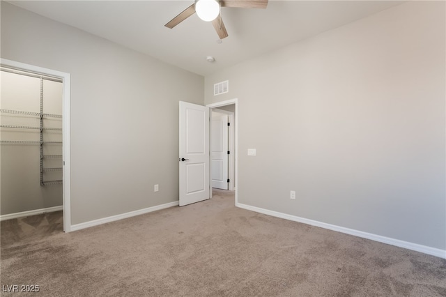 133 Clouded Ave, Henderson, NV 89002 - unfurnished bedroom with carpet floors, baseboards, a closet, a walk in closet, and a ceiling fan
