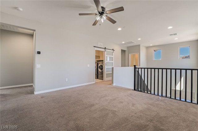 133 Clouded Ave, Henderson, NV 89002 - carpeted spare room with washer / clothes dryer, recessed lighting, a barn door, ceiling fan, and a smoke detector