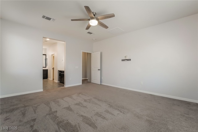 133 Clouded Ave, Henderson, NV 89002 - unfurnished bedroom with carpet, baseboards, a ceiling fan, and ensuite bathroom