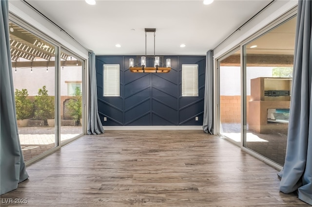 133 Clouded Ave, Henderson, NV 89002 - unfurnished dining area with a chandelier, wood finished floors, and recessed lighting