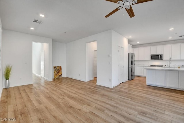 40 Strada Moscato, Henderson, NV 89011 - kitchen featuring stainless steel appliances, open floor plan, a ceiling fan, light countertops, and recessed lighting