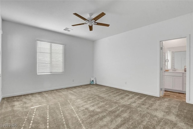 40 Strada Moscato, Henderson, NV 89011 - spare room featuring ceiling fan, carpet flooring, a sink, and baseboards