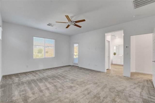 40 Strada Moscato, Henderson, NV 89011 - empty room featuring a ceiling fan, light colored carpet, and baseboards
