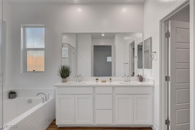 40 Strada Moscato, Henderson, NV 89011 - full bathroom featuring a bath, double vanity, and a shower stall