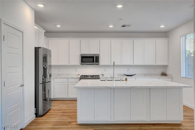 40 Strada Moscato, Henderson, NV 89011 - kitchen with appliances with stainless steel finishes, a sink, white cabinetry, and recessed lighting