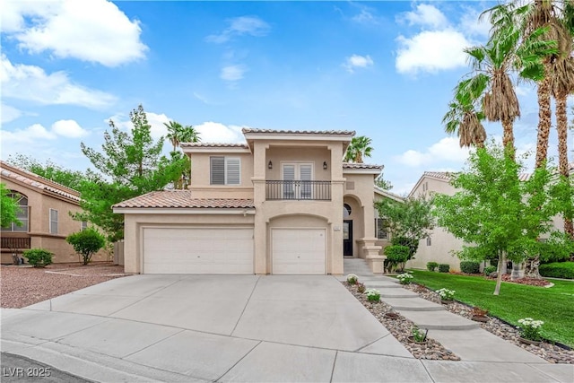 2257 Norway Pine Ct, Las Vegas, NV 89134 - mediterranean / spanish-style home with a balcony, stucco siding, a tile roof, an attached garage, and concrete driveway