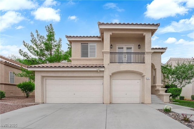 2257 Norway Pine Ct, Las Vegas, NV 89134 - mediterranean / spanish house with a balcony, stucco siding, a tile roof, and a garage