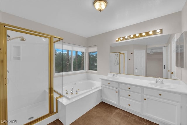 2257 Norway Pine Ct, Las Vegas, NV 89134 - bathroom featuring a stall shower, a bath, double vanity, and tile patterned flooring