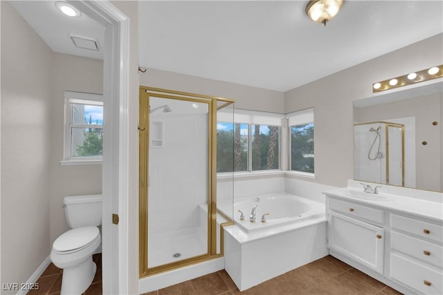 2257 Norway Pine Ct, Las Vegas, NV 89134 - full bathroom with a stall shower, vanity, a garden tub, tile patterned floors, and toilet