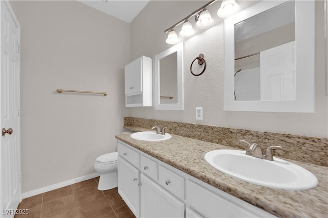 2257 Norway Pine Ct, Las Vegas, NV 89134 - full bathroom with toilet, double vanity, baseboards, and tile patterned flooring