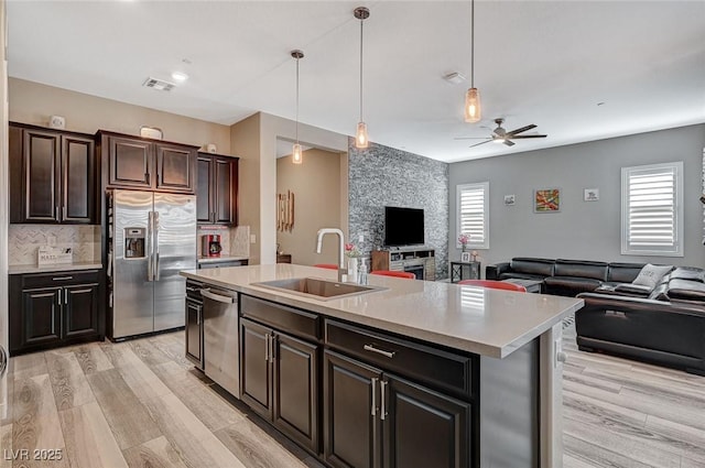 468 Harvest Rain, Las Vegas, NV 89011 - kitchen featuring stainless steel appliances, a sink, open floor plan, and a ceiling fan
