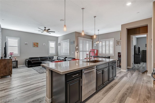 468 Harvest Rain, Las Vegas, NV 89011 - kitchen featuring a sink, dishwasher, light wood-type flooring, a ceiling fan, and a kitchen island with sink