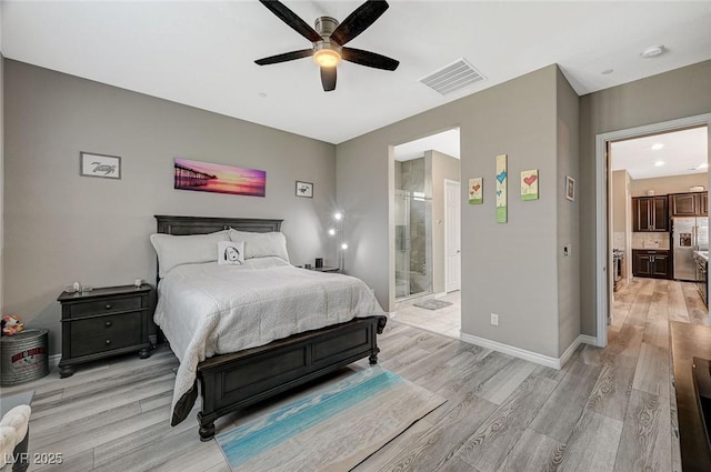 468 Harvest Rain, Las Vegas, NV 89011 - bedroom featuring light wood-type flooring, connected bathroom, stainless steel refrigerator with ice dispenser, and baseboards