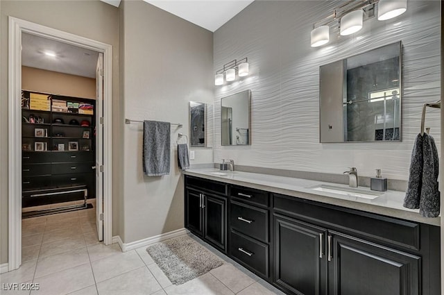 468 Harvest Rain, Las Vegas, NV 89011 - bathroom featuring a spacious closet, baseboards, tile patterned flooring, and double vanity