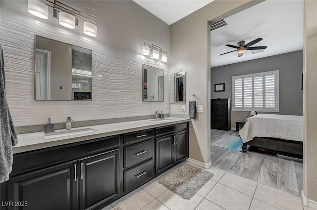 468 Harvest Rain, Las Vegas, NV 89011 - ensuite bathroom featuring ceiling fan, baseboards, double vanity, and tile patterned floors