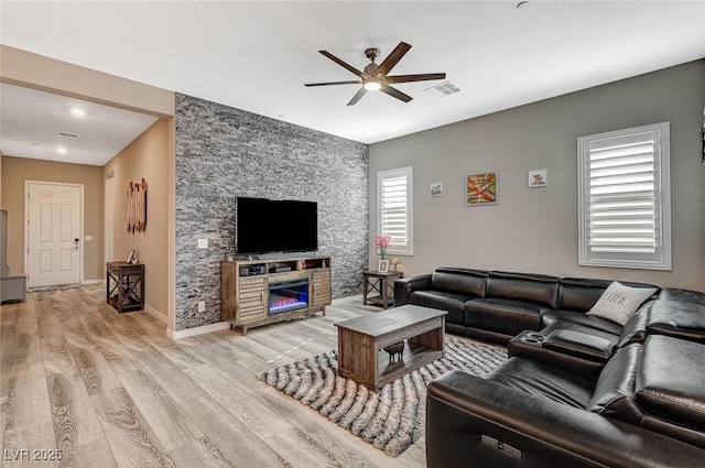 468 Harvest Rain, Las Vegas, NV 89011 - living area with a ceiling fan, light wood-style flooring, and a fireplace