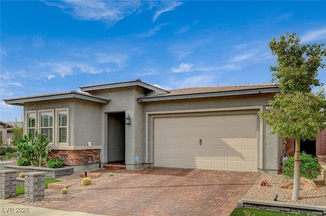 468 Harvest Rain, Las Vegas, NV 89011 - view of front of home featuring stucco siding, decorative driveway, a garage, and brick siding