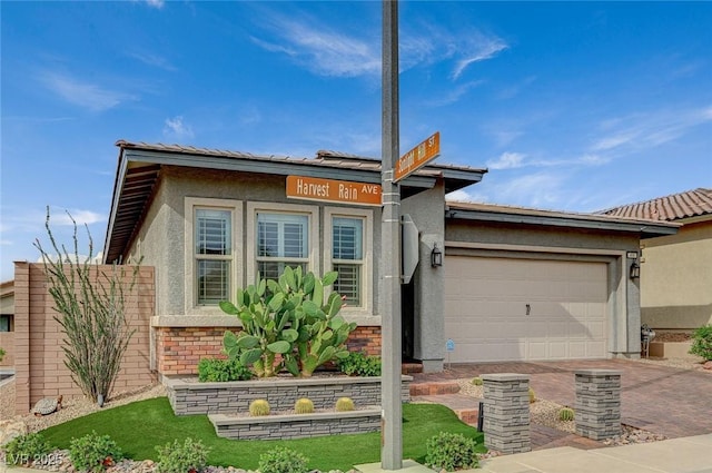 468 Harvest Rain, Las Vegas, NV 89011 - view of front facade featuring an attached garage, stucco siding, decorative driveway, and brick siding