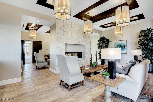 468 Harvest Rain, Las Vegas, NV 89011 - living area featuring a chandelier, light wood-style flooring, baseboards, and a fireplace
