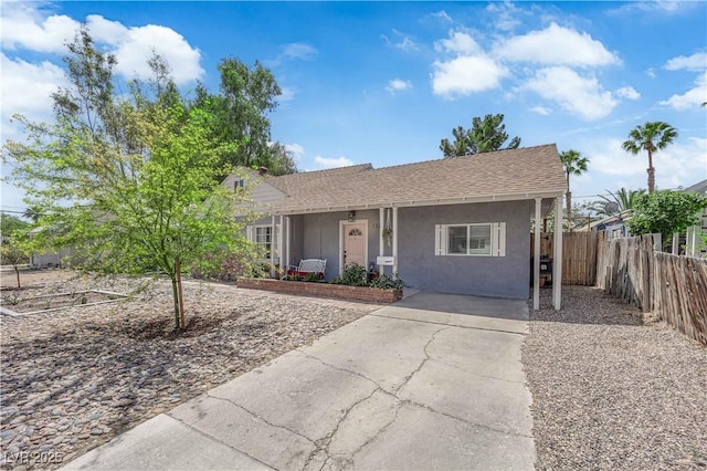 1320 Wengert Ave, Las Vegas, NV 89104 - view of front of property featuring stucco siding, fence, and concrete driveway