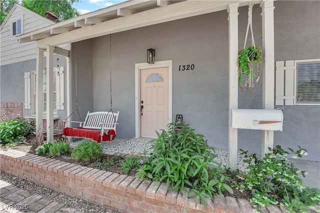 1320 Wengert Ave, Las Vegas, NV 89104 - view of exterior entry with covered porch and stucco siding