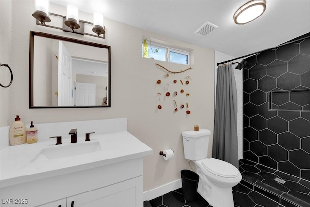 1320 Wengert Ave, Las Vegas, NV 89104 - full bath featuring toilet, tile patterned flooring, a tile shower, vanity, and baseboards
