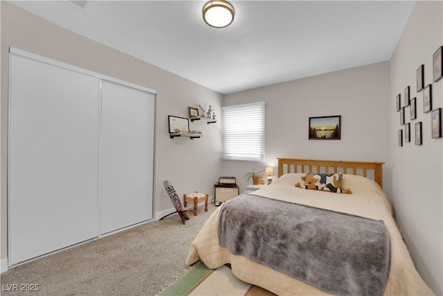 1320 Wengert Ave, Las Vegas, NV 89104 - bedroom featuring carpet flooring, a closet, and baseboards