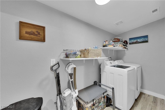 1320 Wengert Ave, Las Vegas, NV 89104 - laundry area with washer and dryer, light wood-type flooring, and baseboards