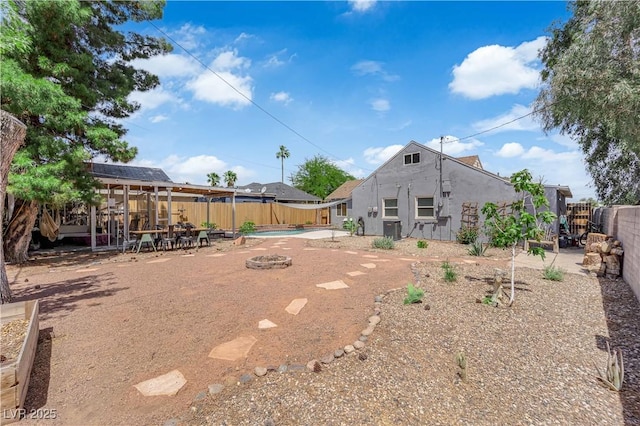 1320 Wengert Ave, Las Vegas, NV 89104 - fenced backyard featuring cooling unit and a patio