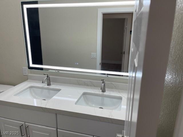 8847 W Katie Ave, Las Vegas, NV 89147 - bathroom with double vanity and toilet