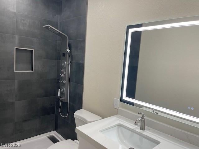 8847 W Katie Ave, Las Vegas, NV 89147 - full bath featuring toilet, tiled shower, and vanity