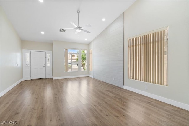 8847 W Katie Ave, Las Vegas, NV 89147 - unfurnished living room featuring a ceiling fan, wood finished floors, baseboards, recessed lighting, and high vaulted ceiling