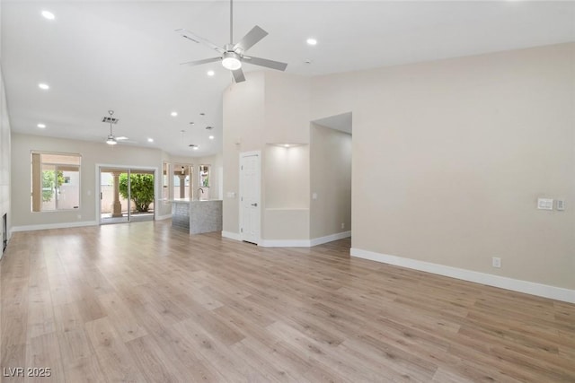 8847 W Katie Ave, Las Vegas, NV 89147 - unfurnished living room with ceiling fan, baseboards, light wood-style flooring, recessed lighting, and high vaulted ceiling