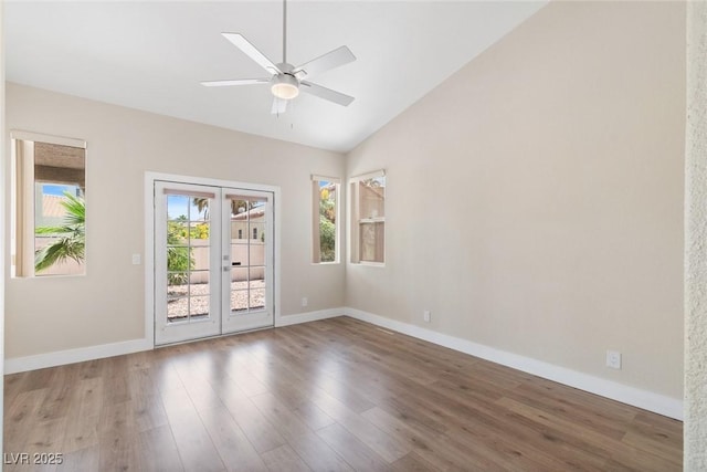 8847 W Katie Ave, Las Vegas, NV 89147 - empty room featuring french doors, lofted ceiling, wood finished floors, ceiling fan, and baseboards