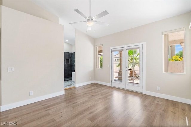 8847 W Katie Ave, Las Vegas, NV 89147 - empty room with wood finished floors, baseboards, vaulted ceiling, and ceiling fan