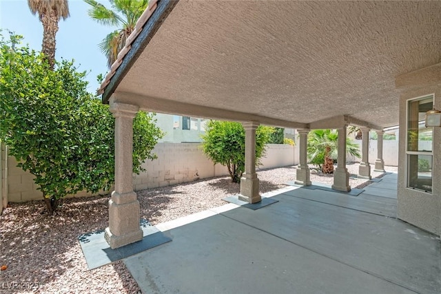 8847 W Katie Ave, Las Vegas, NV 89147 - fenced backyard with a patio area