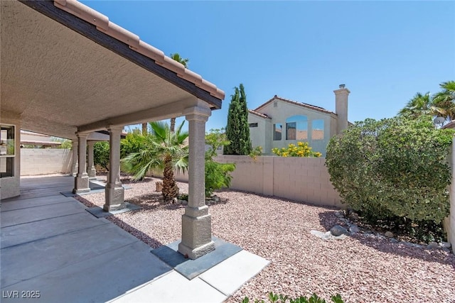 8847 W Katie Ave, Las Vegas, NV 89147 - fenced backyard featuring a patio