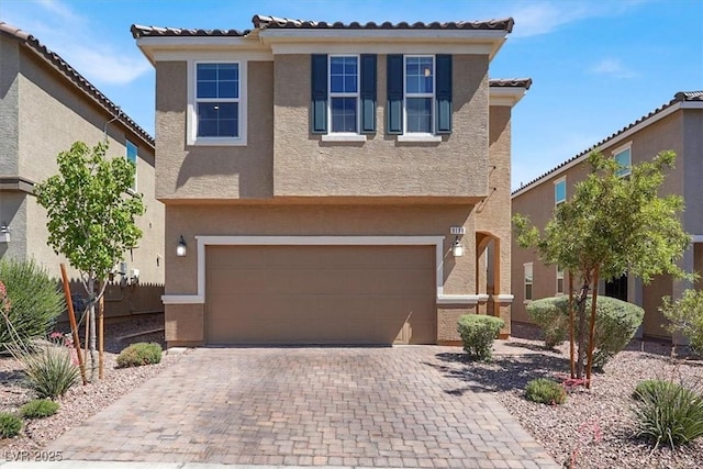 9198 Harbin Ave, Las Vegas, NV 89148 - traditional-style home featuring stucco siding, a garage, a tiled roof, and decorative driveway