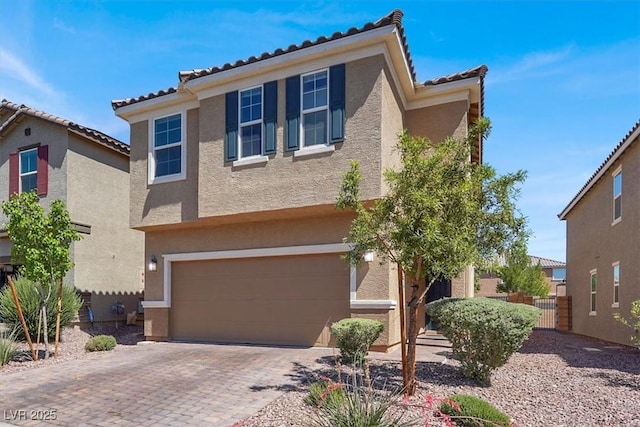 9198 Harbin Ave, Las Vegas, NV 89148 - view of front of house featuring stucco siding, a tiled roof, a garage, and driveway