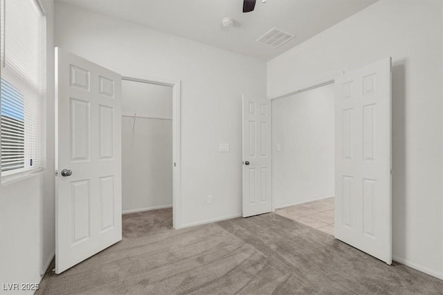 9198 Harbin Ave, Las Vegas, NV 89148 - unfurnished bedroom featuring carpet flooring, a spacious closet, a closet, and a ceiling fan