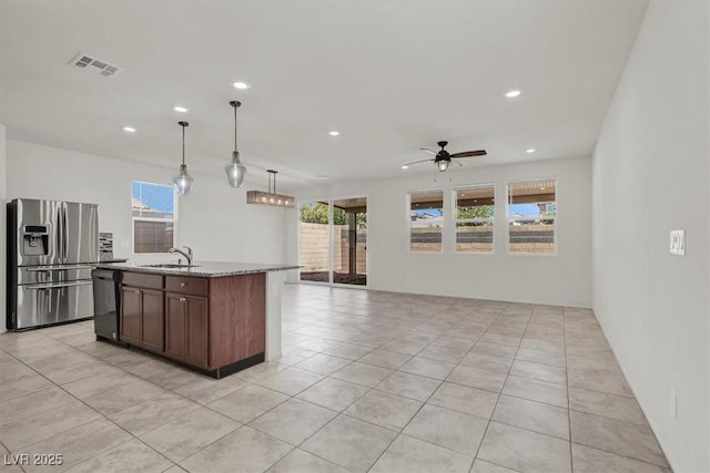 9198 Harbin Ave, Las Vegas, NV 89148 - kitchen featuring stainless steel fridge with ice dispenser, black dishwasher, a sink, recessed lighting, and plenty of natural light