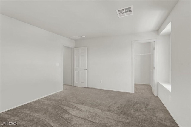 9198 Harbin Ave, Las Vegas, NV 89148 - unfurnished bedroom with carpet, a walk in closet, a closet, and baseboards