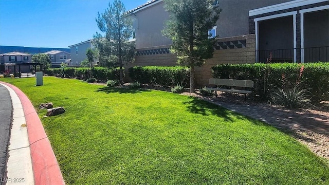 9198 Harbin Ave, Las Vegas, NV 89148 - view of property's community featuring a lawn and a residential view