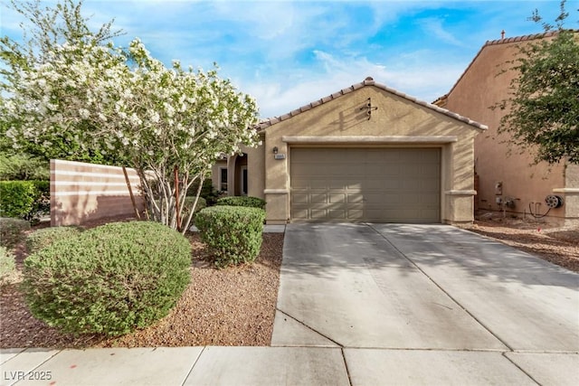 3005 Dotted Wren Ave, North Las Vegas, NV 89084 - view of front of property with driveway, a garage, stucco siding, and a tile roof